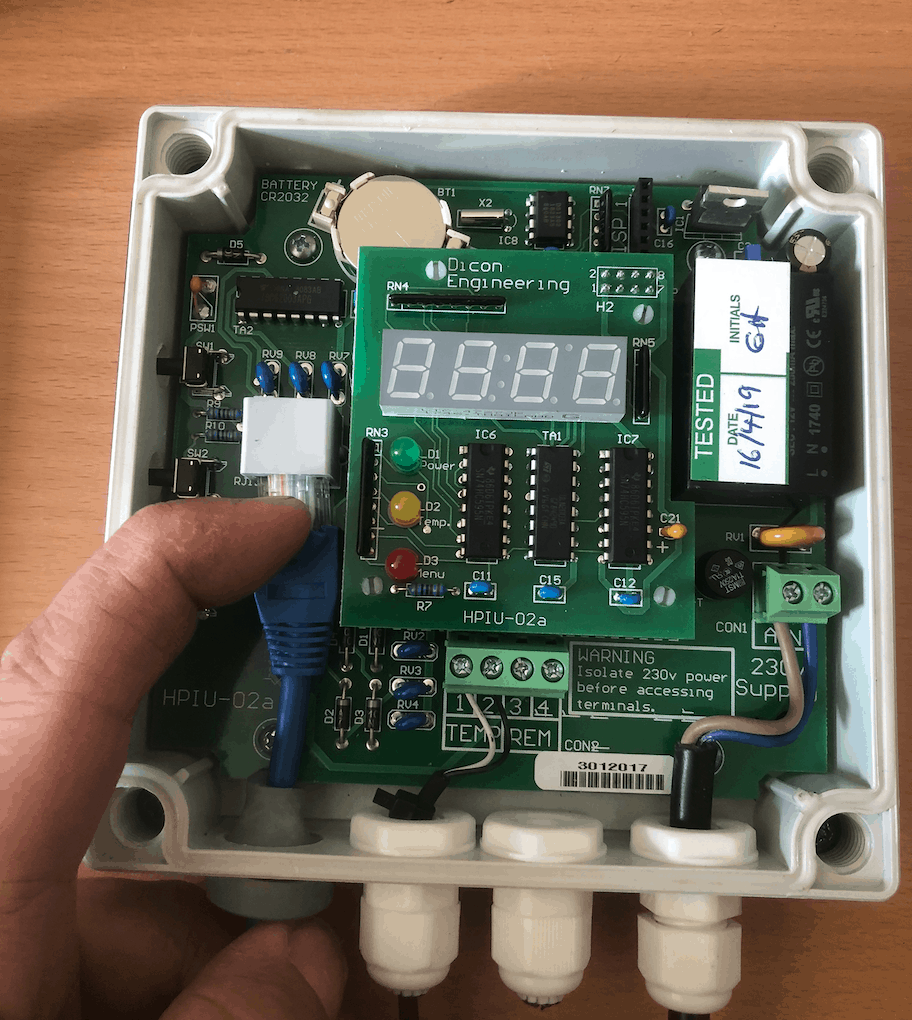 Disconnecting the patch cable inside the Reclaim Energy heat pump controller